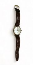 Longines, a 1970's Longines 9ct gentleman's wristwatch, the signed 31mm dial with gilt baton markers