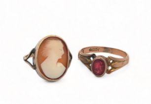 Two gold rings. A red stone ring (stone very badly damaged), marked for maker A.G.G and stamped '9