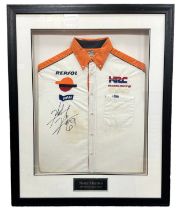 Framed signed Nicky Hayden Honda shirt. Nicky Hayden was a MotoGP champion in 2006. Shirt has slight