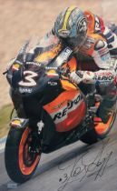 Framed signed Max Biaggi Picture. Max Biaggi is a former Grand Prix Motorbike winner. No COA,