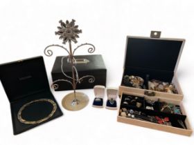 A lockable jewellery box containing a quantity of costume jewellery including an abalone shell