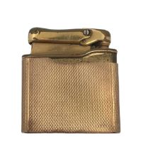 A Calibri Monogas lighter in a 9ct gold engine turned case . Calibri stamp and hallmarks to base.