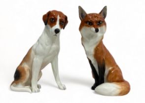 Royal Worcester fox (No. 2993) and hound (No. 2994) figurines. Stamp to base. Fox 19cm high. Very