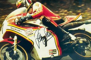 Framed signed Barry Sheene picture. Barry Sheene on a Suzuki motorcycle. COA from Heroes Memorabilia