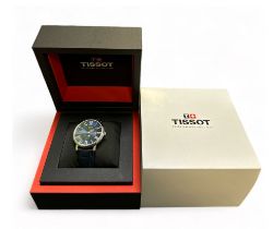 Tissot T-Classic Carson 40mm Moon Phase Men's Watch, features a blue dial with Roman numerals and