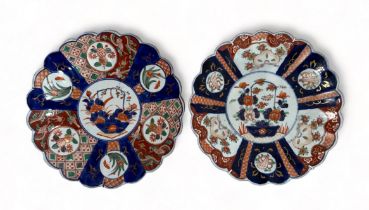 Pair of Japanese Imari scalloped edged plates, both having central floral decoration with further