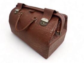 A vintage large leather 'crocodile skin' Gladstone bag. Dimensions approx 50cm x 30cm. Small tear on