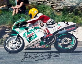 Framed signed Joey Dunlop picture. Dunlop is a Isle of Man TT legend, with 26 wins. Voted N.