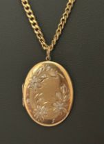 A hallmarked 9ct gold oval locket with a bi-coloured flower design. Suspended from a hallmarked