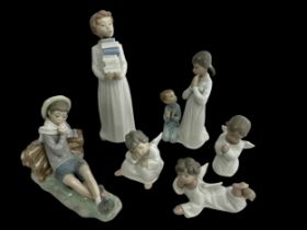 Six pieces of Lladro porcelain. Includes figures of: a boy carrying books, three cherubs, a young