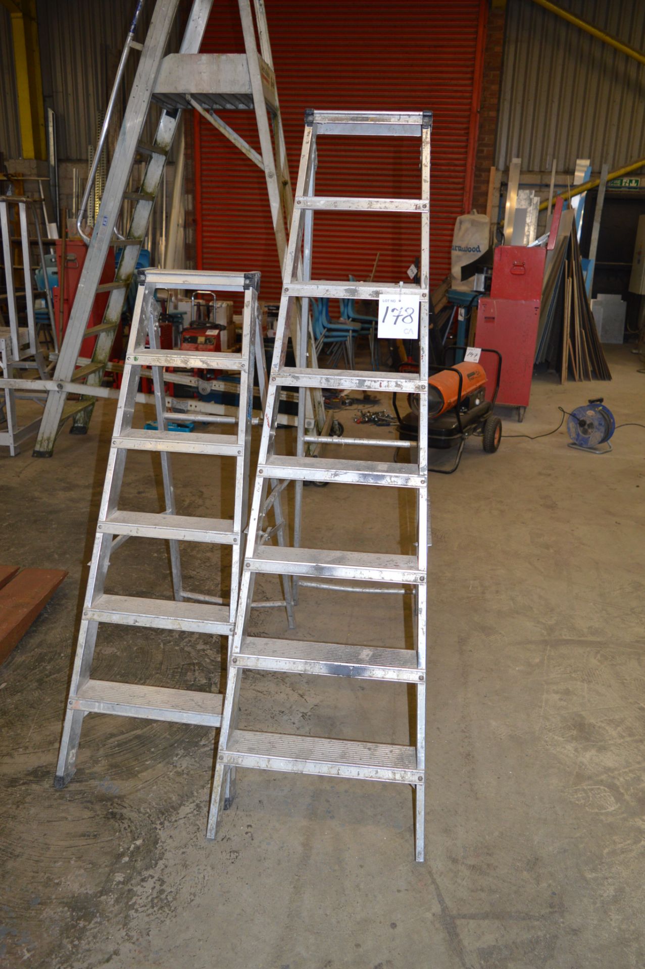 2 - alloy step ladders ** No VAT on hammer price but VAT will be charged on the buyer's premium **