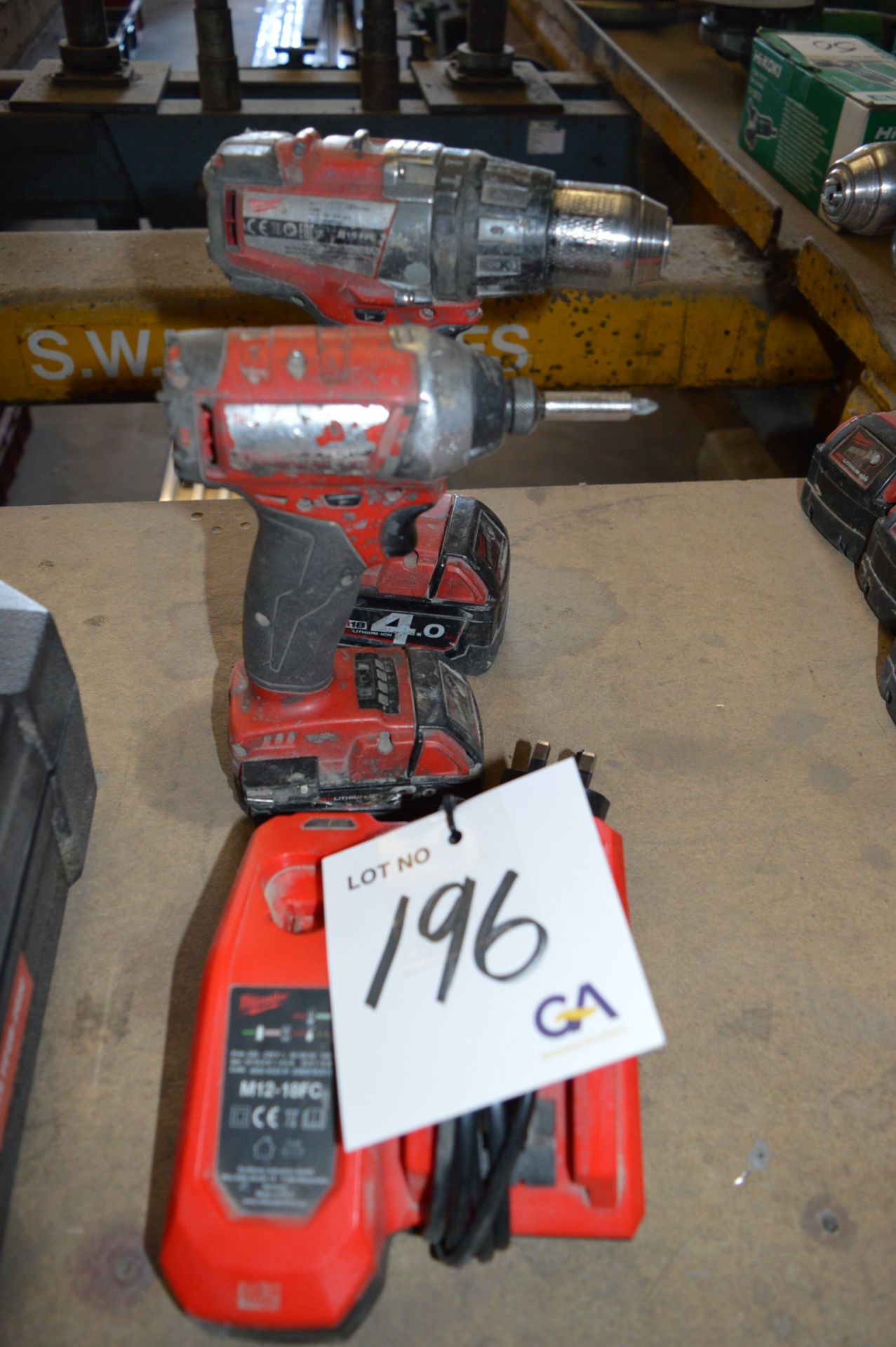 Milwaukee drill, Milwaukee screwdriver c/w charger and 2 batteries ** No VAT on hammer price but VAT