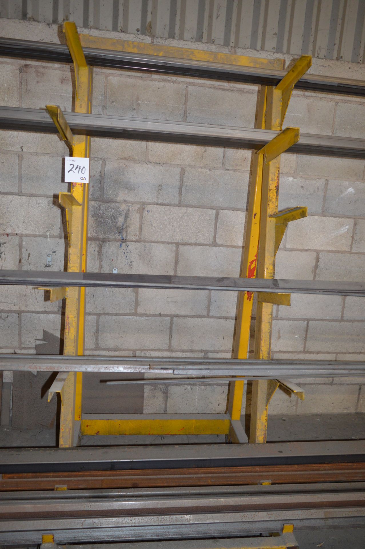 2 - 6 tier mobile steel stock racks and contents of steel stock Including angle, box etc. ** No