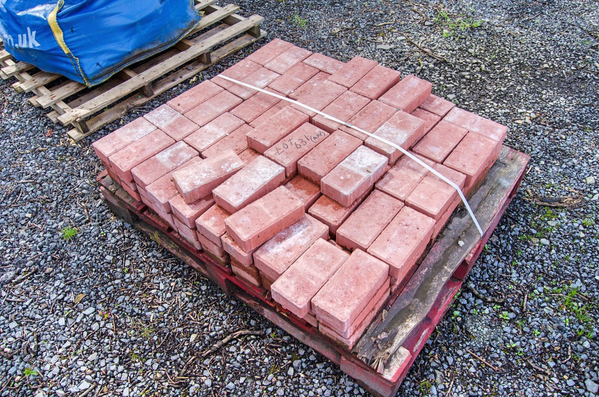 Pallet of red paving blocks