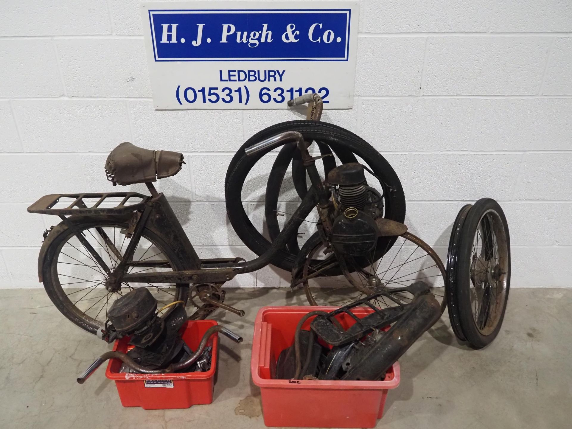 Velosolex autocycle project with boxes of assorted spares to include wheel rims, tyres, engine