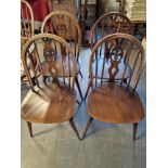 Quartet of Ercol Fleur De Lys Motif Stick Back Dining Chairs