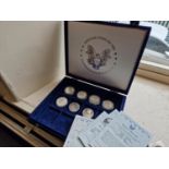 Cased Collection of Seven American USA Silver Dollar Coins