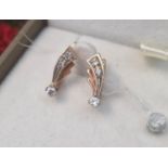 Pair of 14ct White/Rose Gold Shooting Stars, 2.27g