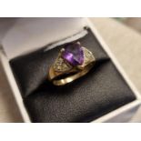 Large 9ct Gold and Diamond Ring featuring a Strong Purple stone, 3.2g, size N
