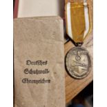 1939 German Carl Poellath Schrobenhausen West Wall Medal with Paper Packet