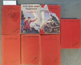 A Collection of 7 Vintage Hardback 'Famous Five' books by Enid Blyton, comprising 'Five Get Into a F