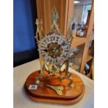 Vintage Brass Skeleton Clock on Wooden Base with Key - height approx 38cm