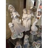 Trio of Lladro and Nao Porcelain Figures