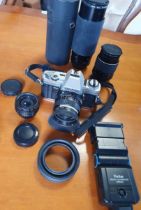 Minolta X-300 SLR camera, w. Hoya standard 52mm lens, Nikon 135mm lens, Hoya Skylight 52mm lens 2x a