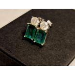 Pair of 18ct White Gold, Emerald & Diamond Stud Earrings - each set with single 1ct emerald cut ston