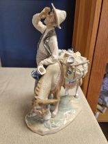 Lladro Donkey and Man Figure titled 'Typical Peddler'