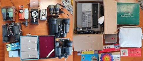 Collection of binoculars (Hanimex, Prinz, Tecnar), Kodak cameras, slide projector, carry-cabinet, ac