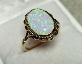 9ct Gold & Opal Dress Ring, set with single opal (measures 14x10mm approx). Size R and weighs 2.6g