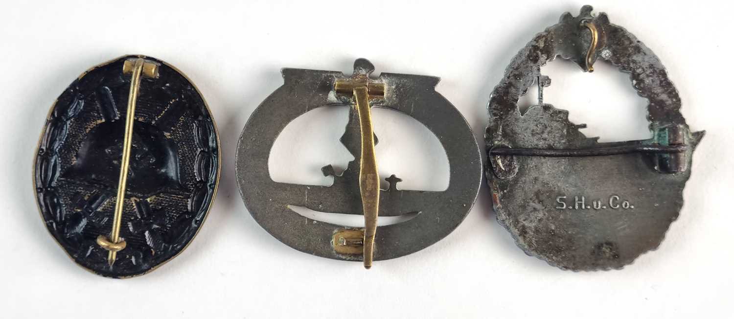 A German Third Reich wound badge in black, marked L/54 for Schauerte & Höhfeld, Lüdenscheid; - Image 2 of 2