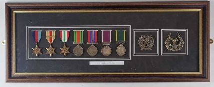 A framed display of Second World War medals, comprising 1939-45 Star, Africa Star with 1st Army
