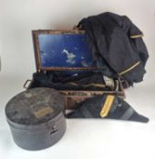 A small rectangular tin trunk containing a Victorian Naval Officer's full dress tail coat, gilt