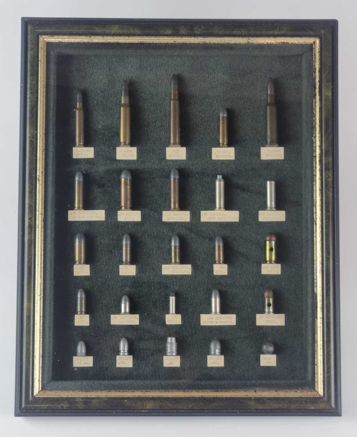 Framed display of inert ammunition