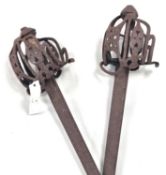 A pair of 18th-century Scottish Basket-hilted swords with 35" blades, hilts pierced with hearts