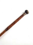 A late 19th/early 20th-century walking cane / pig sticker, with a flattened knop horn handle,