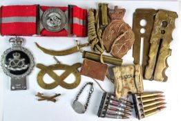 A mixed assortment of militaria comprising "Duke of Wellington's Regiment" belt, ten ammunition