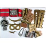 A mixed assortment of militaria comprising "Duke of Wellington's Regiment" belt, ten ammunition