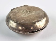 A military silver circular snuff box with hinged cover, Birmingham 1912, with match striker in edge,