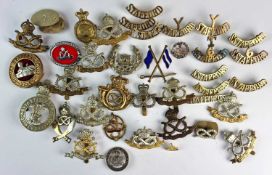 A quantity of white metal and brass badges - both originals and re-strikes. Including