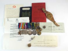 A group of WWII medals, titles, badges, paperwork & two WWI photographs