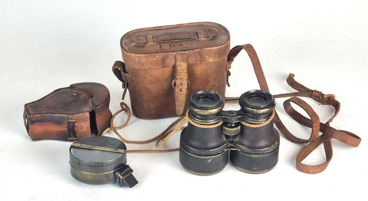 Compass and mirror clinometer and a pair of marine binoculars