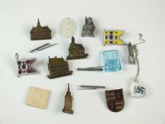 A group of German Third Reich plastic and perspex badges, mostly donation