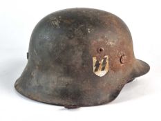 A German M42 helmet, with single post-war SS-style decal and a post-war brown eight-finger leather