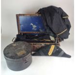 A small rectangular tin trunk containing a Naval Officer's or Court Uniform full dress tail coat,