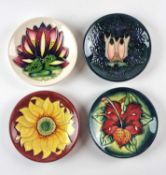 Four Moorcroft pin dishes including Cluny and Inca