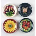 Four Moorcroft pin dishes including Cluny and Inca