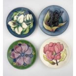 Four Moorcroft pin dishes including Bermuda Lily and Black Tulip